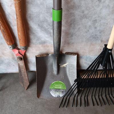 YARD TOOLS, PARTIAL BAG OF FERTILIZER AND A PUSH BROOM