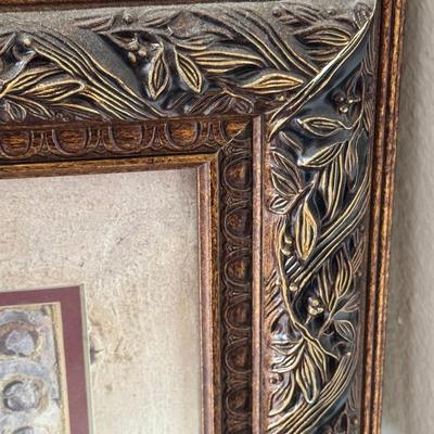 Two framed art pieces, with the larger one identified as a framed watercolor painting.