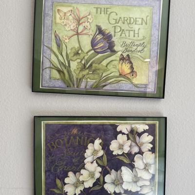 Framed botanical art print featuring white dogwood flowers.