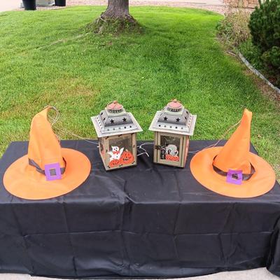 2 HALLOWEEN CANDLE LANTERNS AND WITCH HATS THAT ARE SUPPOSE TO LIGHT UP