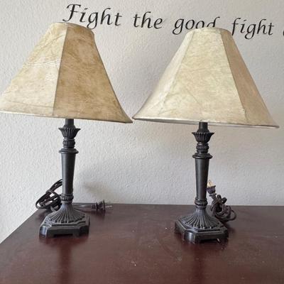 Two table lamps and artificial Monstera Plant.