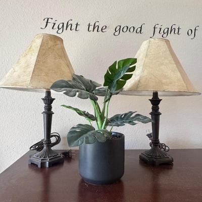 Two table lamps and artificial Monstera Plant.