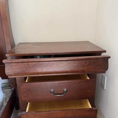 Designer nightstand with three drawers.