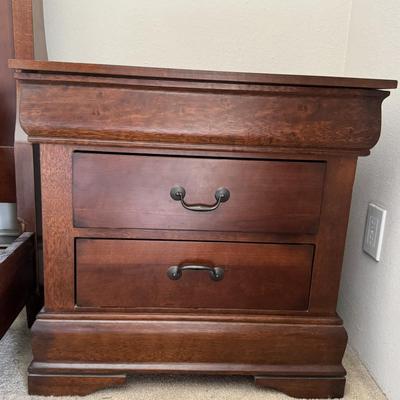 Designer nightstand with three drawers.