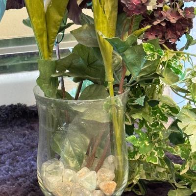 Two artificial dieffenbachia plants.