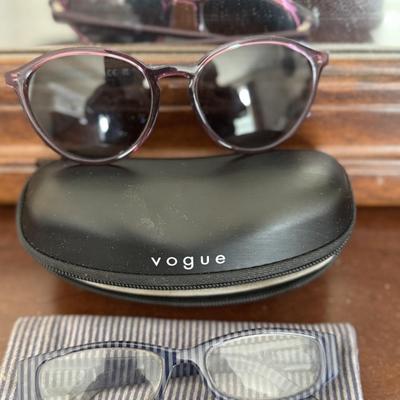 Sunglasses, prescription glasses, and magnifying glass.