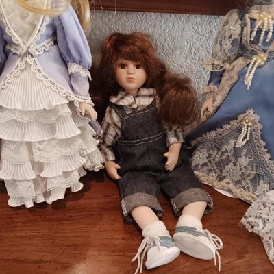4 PORCELAIN DOLLS
