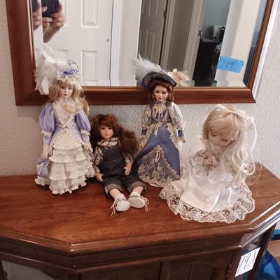 4 PORCELAIN DOLLS