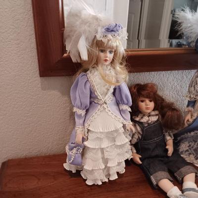 4 PORCELAIN DOLLS