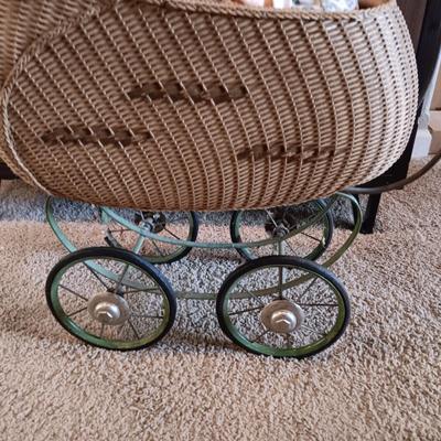 ANTIQUE WICKER BABY STROLLER AND A 1998 CITITOY DOLL