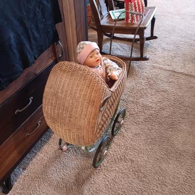 ANTIQUE WICKER BABY STROLLER AND A 1998 CITITOY DOLL