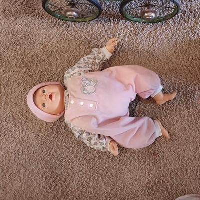 ANTIQUE WICKER BABY STROLLER AND A 1998 CITITOY DOLL