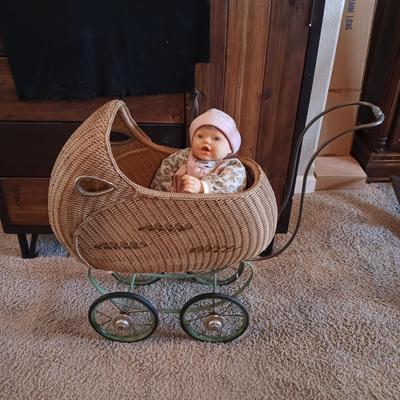 ANTIQUE WICKER BABY STROLLER AND A 1998 CITITOY DOLL