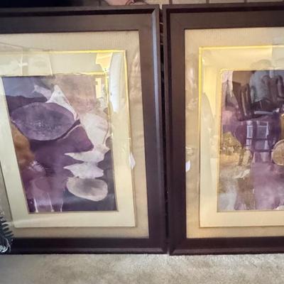 Two framed abstract art prints.