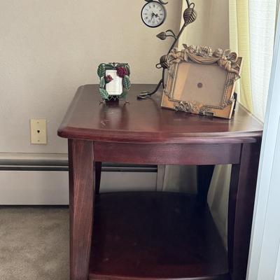 End table with home decor items.