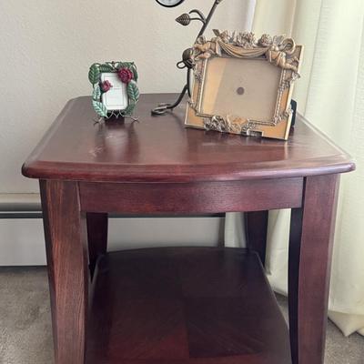 End table with home decor items.