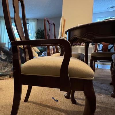 Dining table with four chairs and with a leaf.