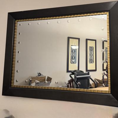 Modern wall hanging mirror.