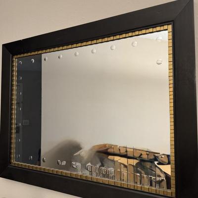 Modern wall hanging mirror.