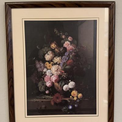 The prints features a vibrant bouquet of flowers, including carnations, tulips, peonies, roses, and tuberoses, arranged in a terracotta...
