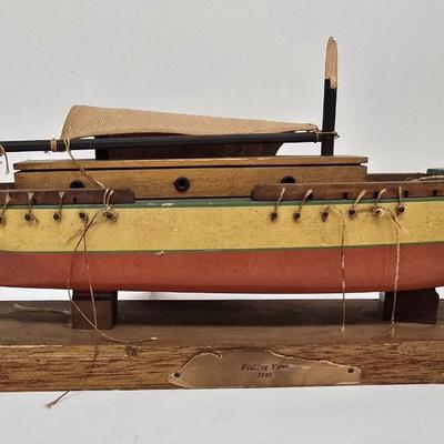 LOT 211: Globe with Two Wood Model Ships