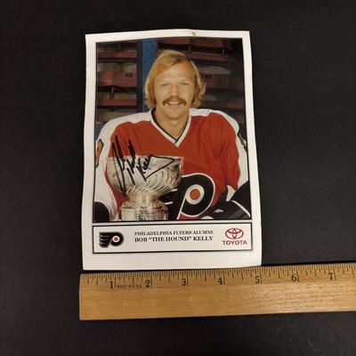 LOT 222: Autographed Canada Dry Philadelphia Flyers Banks, Bob Kelly Photograph & Unopened Can