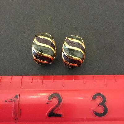 Vintage gold tone enamel clip on earrings. Very nice.
