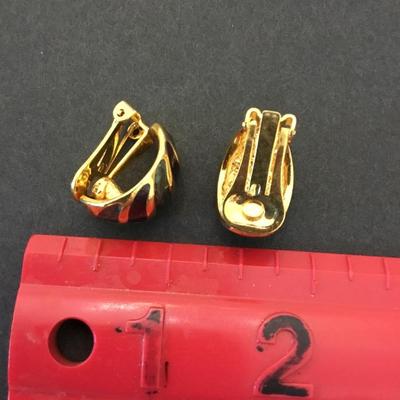 Vintage gold tone enamel clip on earrings. Very nice.