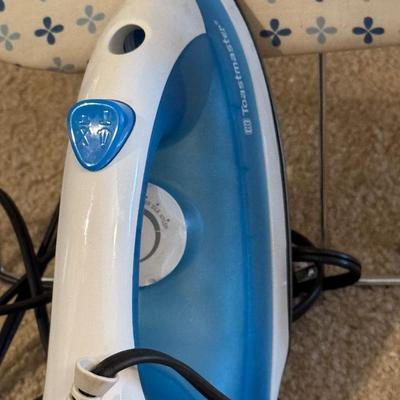 Two ironing boards, one iron.