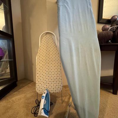 Two ironing boards, one iron.
