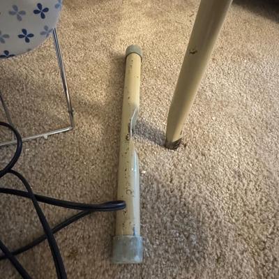 Two ironing boards, one iron.