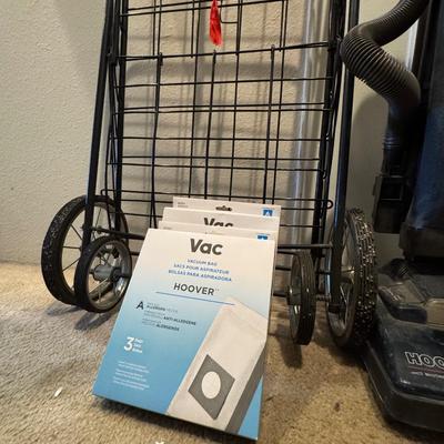 Folding shopping or utility cart. Hoover vacuum cleaner.