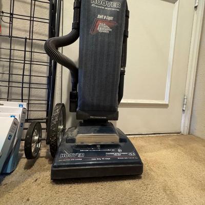 Folding shopping or utility cart. Hoover vacuum cleaner.