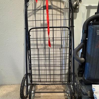 Folding shopping or utility cart. Hoover vacuum cleaner.