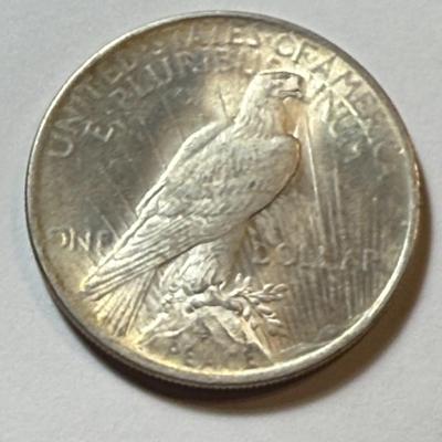1924-P UNCIRCULATED CONDITION TONED PEACE SILVER DOLLAR COIN #3 AS PICTURED.