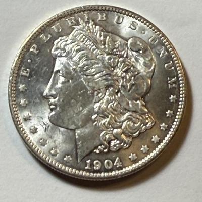 1904-O UNCIRCULATED CONDITION MORGAN SILVER DOLLAR COIN #8 AS PICTURED.
