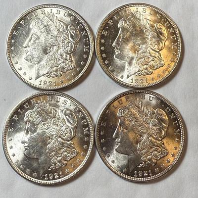 (4) 1921-P UNCIRCULATED CONDITION MORGAN SILVER DOLLARS AS PICTURED.