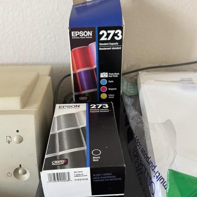 Two printers with printer supplies.