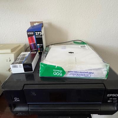 Two printers with printer supplies.