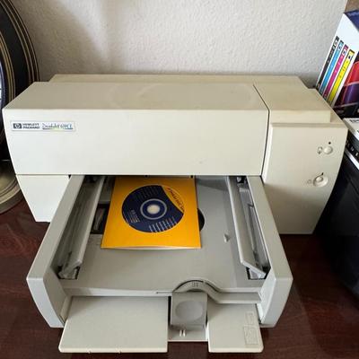 Two printers with printer supplies.