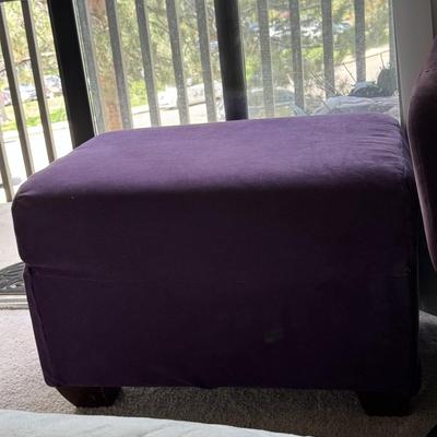 Modern leisure or office chair with a velvet upholstery and a matching ottoman.
