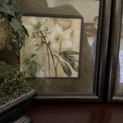 The artworks in the image is a floral print titled "Captive Beauty" by artist Dennis Carney.