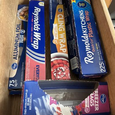 Various food storage essentials, primarily featuring products from Reynolds and Kroger brands.