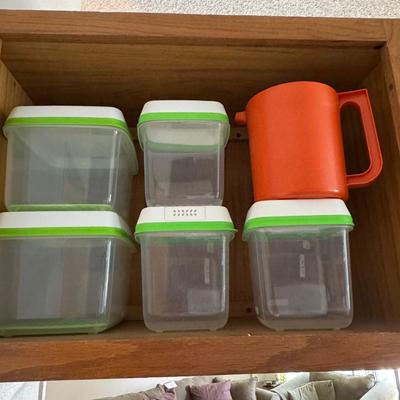 Rubbermaid FreshWorks Produce Saver containers and a vintage orange Tupperware pitcher.