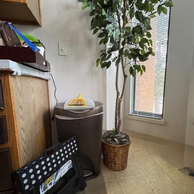 Artificial ficus tree and trashcan and step stool.
