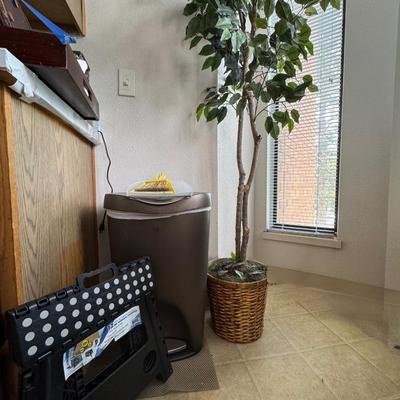 Artificial ficus tree and trashcan and step stool.
