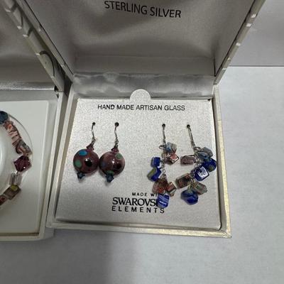 "STERLING SILVER" and "HAND MADE ARTISAN GLASS"