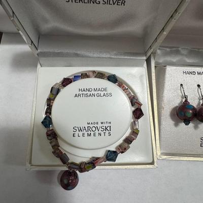 "STERLING SILVER" and "HAND MADE ARTISAN GLASS"