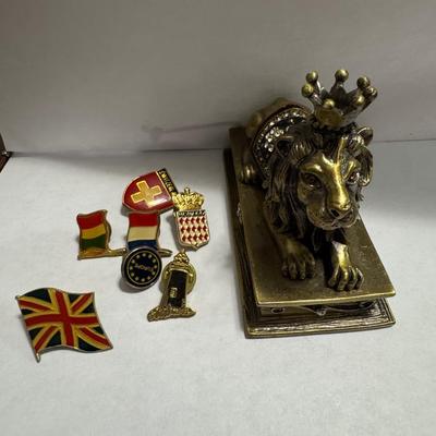 Vintage Borghese Recumbent Lion box and collection of lapel pins.