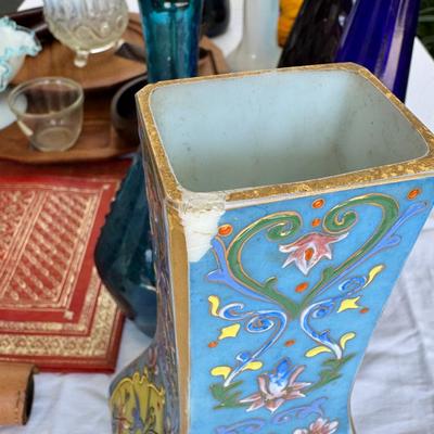 Sale Photo Thumbnail #122: Window large vintage bottle collection , white swung vase. Patterned decanter . Bottle stoppers not matching bottles. Blue Chinese vase with flaws. Teak lazy Susan with "legs" nut cracker and fish box. Patterned gold and red leather portfolio cover. Leath